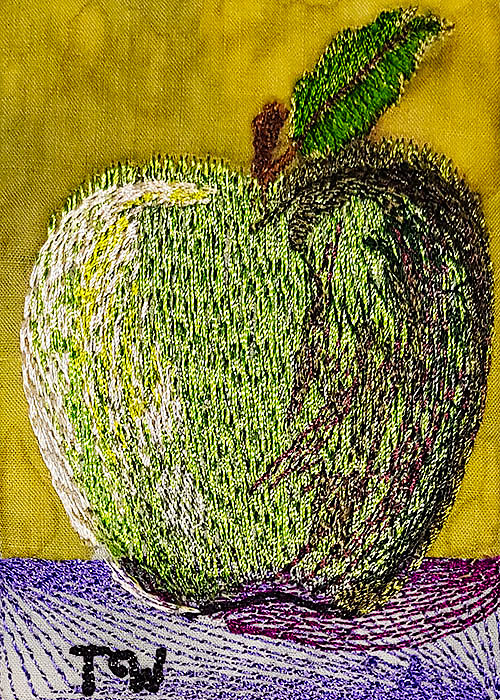 Machine embroidered artist trading card featuring an apple