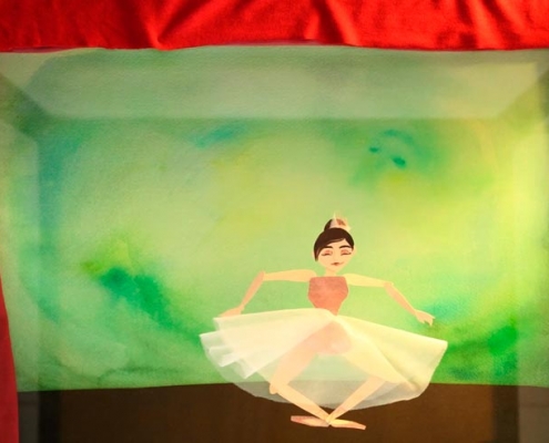 "Ballerina" - stop motion animation of a dancing ballerina in tutu on a green stage with red curtains, by Elena Ferrarin
