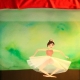 "Ballerina" - stop motion animation of a dancing ballerina in tutu on a green stage with red curtains, by Elena Ferrarin