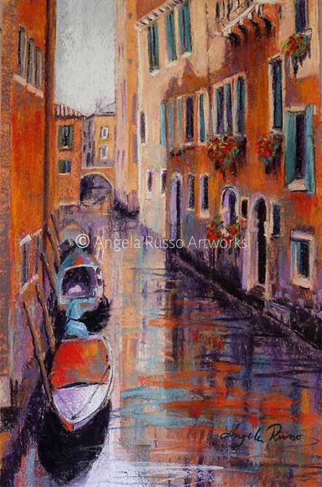 "Venice Canal" - pastel painting in warm tones of orange and mauve. of boats moored in a canal surrounded by tall old style buildings - by Angela Russo