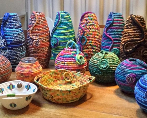 brightly coloured coiled fabric pots by Maggie Bush