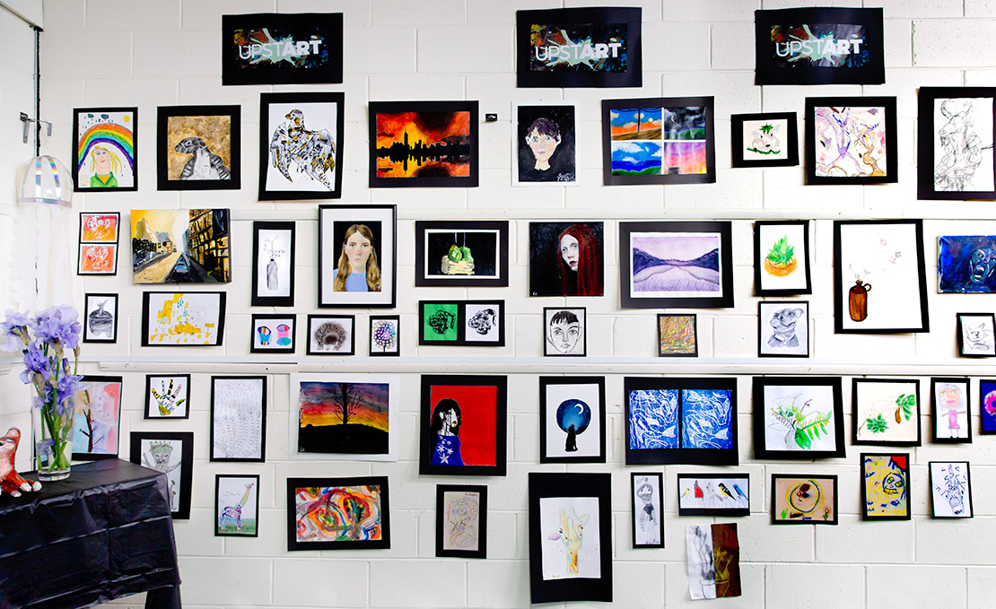 Childrens' exhibition at the 2022 Spring Art Show. Children's artwork displayed on wall.