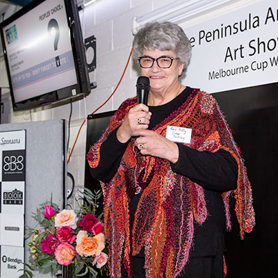 Textiles Judge Bev Tully speaking at the 2022 Spring Art Show Opening