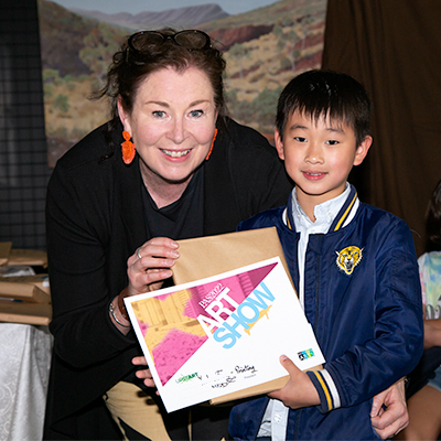 2022 Spring Art Show Childrens' Art Awards - tutor Maxine Pritchard presenting prize to student