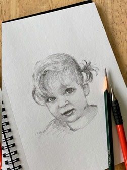 Graphite drawing of young girl by Maria Radun