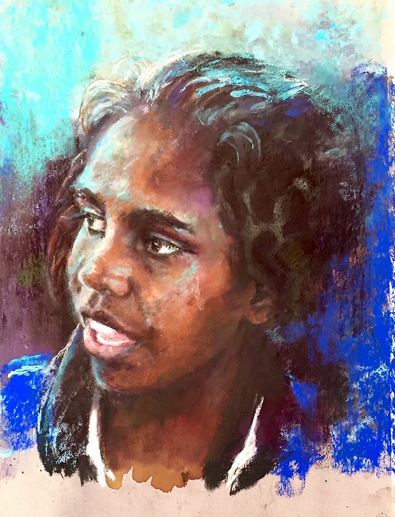 Head and shoulders pastel portrait of a young Australian indigenous girl by Liz Turner.