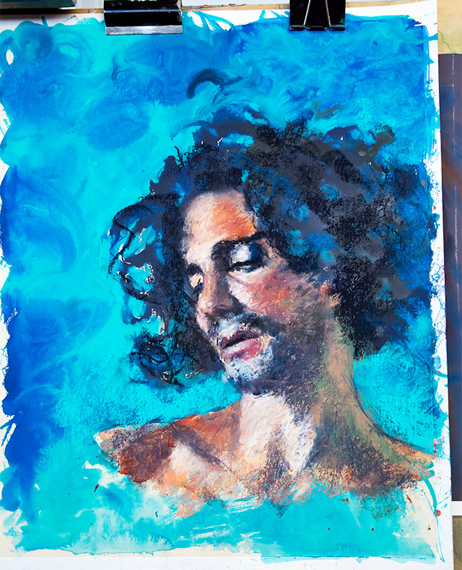 Acrylic and pastel portrait by Liz Turner of a young man with long curly black hair against a vibrant blue background.