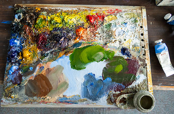 Ben Winspear's oil painting palette, with lots of mixed colours and older dried colours.