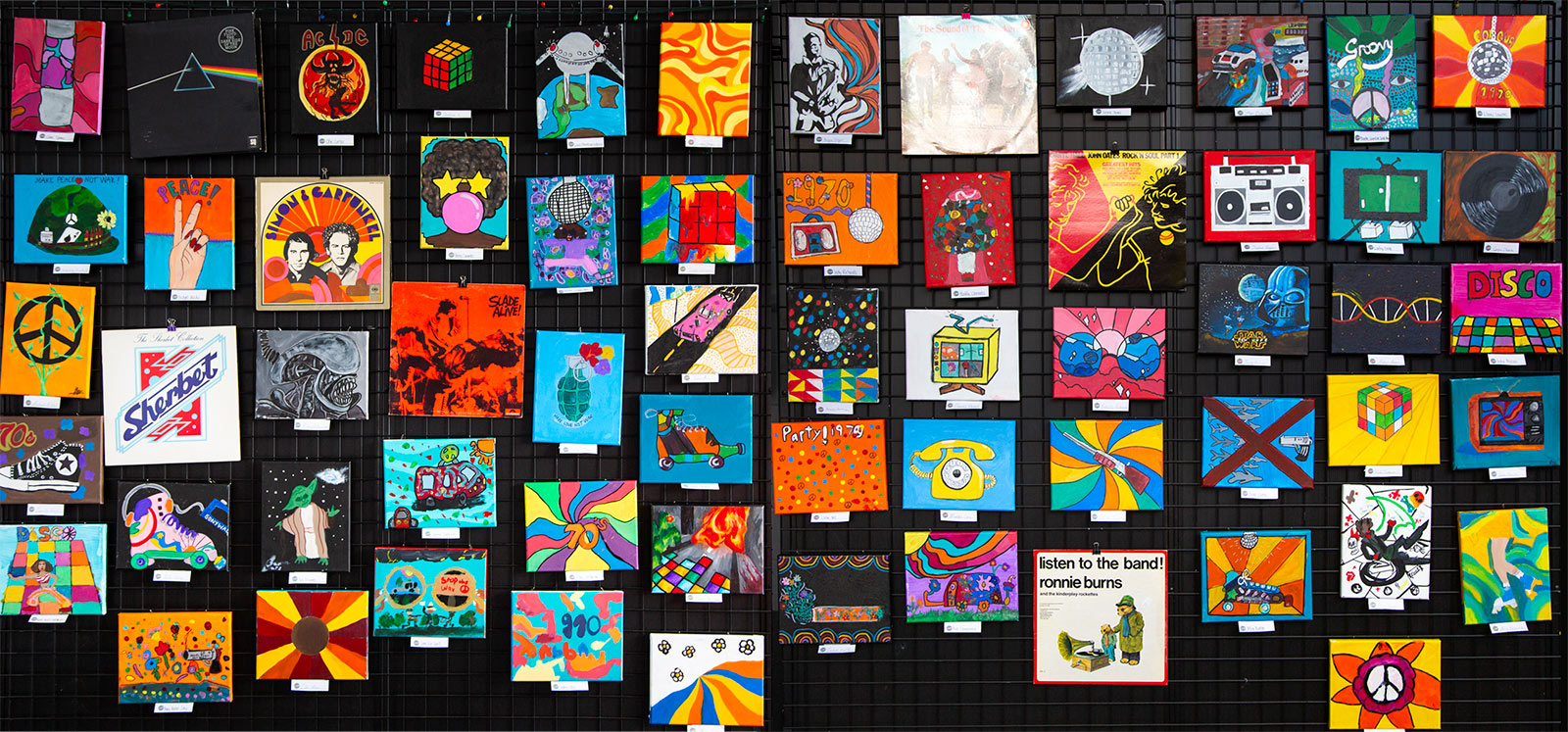 Peninsula Arts Society 70th Birthday Kids Artwork. Brightly coloured small canvases with 70s themed artwork.