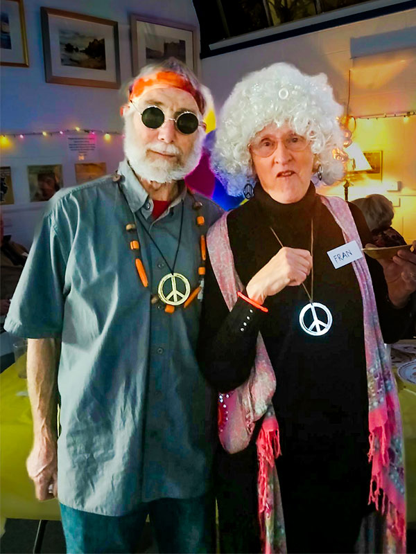 Joyful Couple. Two older people dressed in hippie clothes.