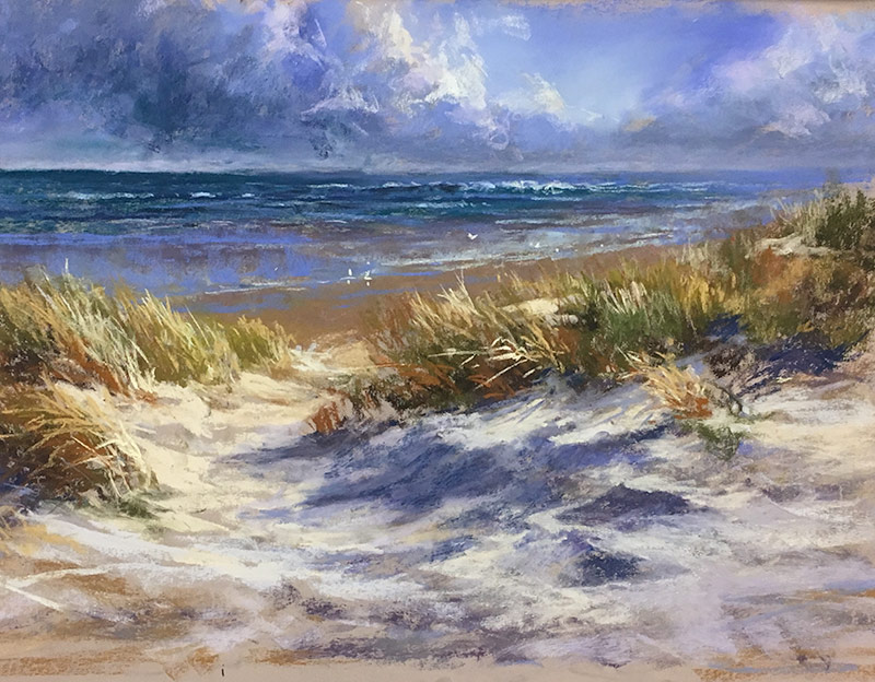 Seascape in pastel by Lyn Mellady. Rough sea and cloudy sky with windswept dunes and grasses in foreground.