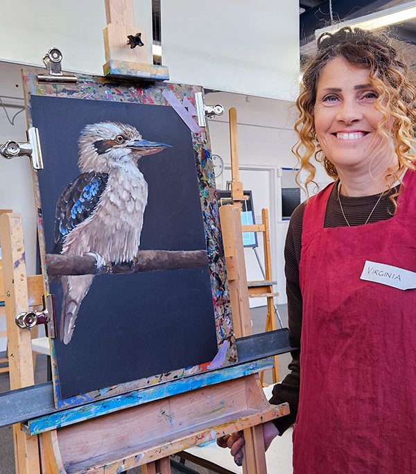Angela Russo Pan Pastel Workshop - Verginia- woman holding pastel painting of a kookaburra.