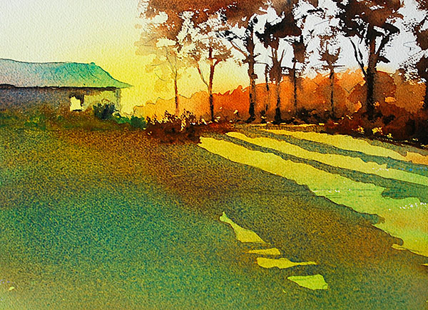 Malcolm Beattie - Mittagong Sunrise - Watercolour. Sun rising behind a house and line of trees with long shadows falling across a grassy foreground.