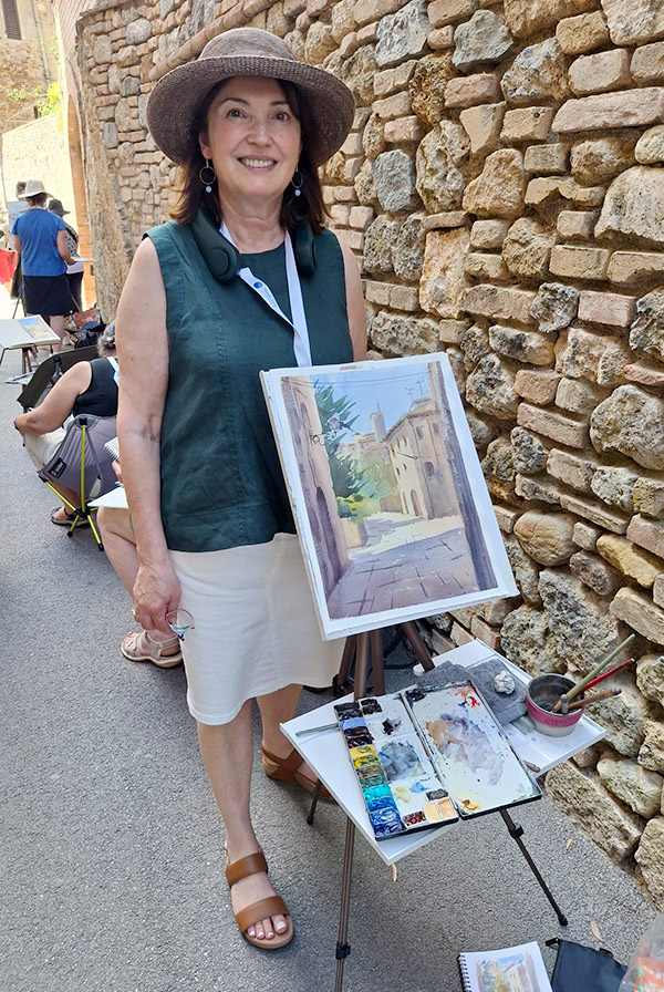 Vivi Palegeorge en plein air tour. Photo of Vivi with a watercolour streetscape.